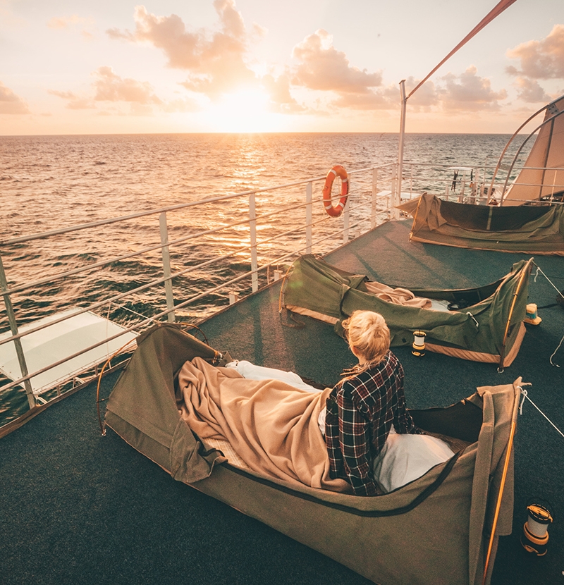 lady waking up on board a Reefsleeper boat