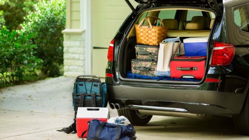 lots of bags in the back of a car