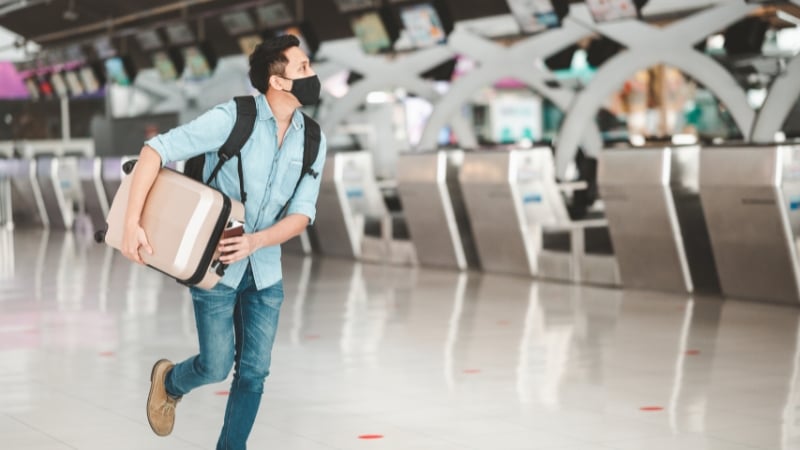 man with his luggage bag at the airport