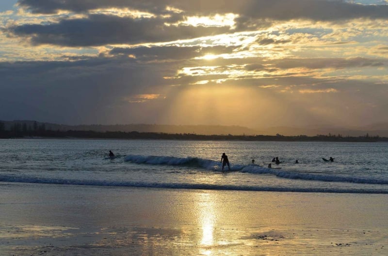 Surfers on Belongil Beach Byron Bay