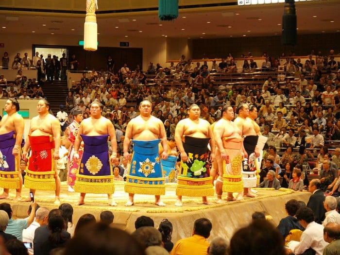 Crowd watching sumo wrestling