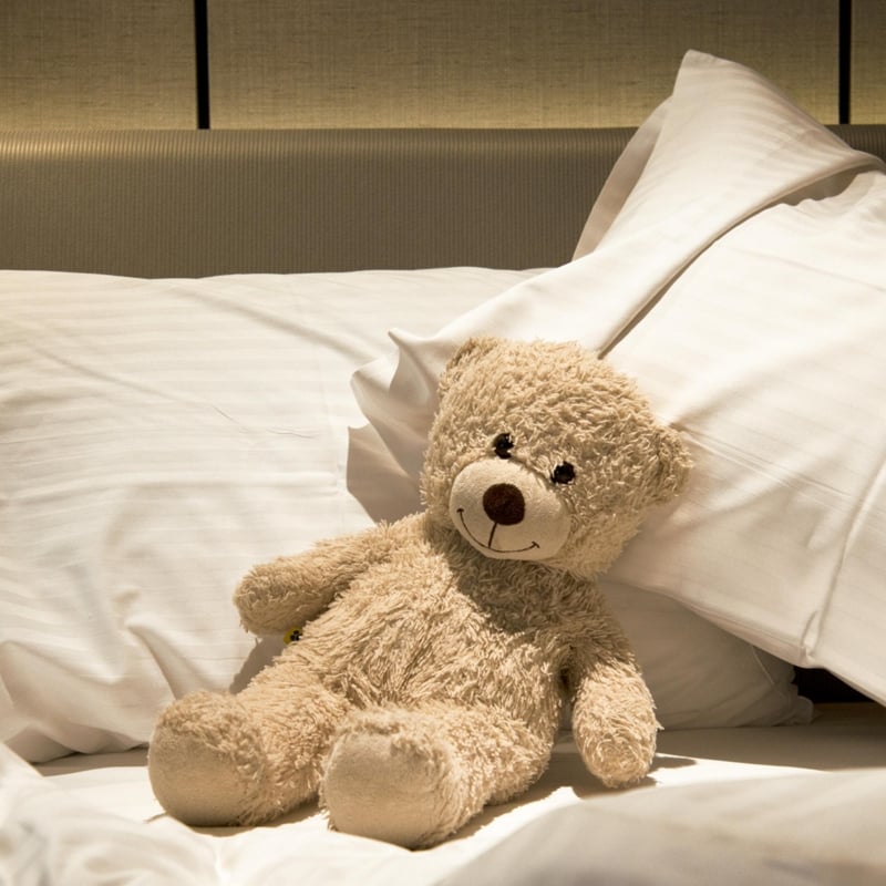 teddy bear on bed