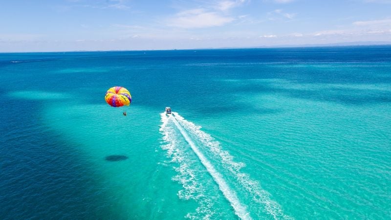 parasailing over sea