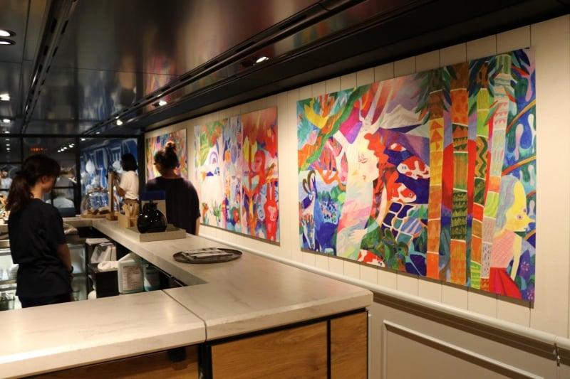 artwork displayed on walls of genbi shinkansen