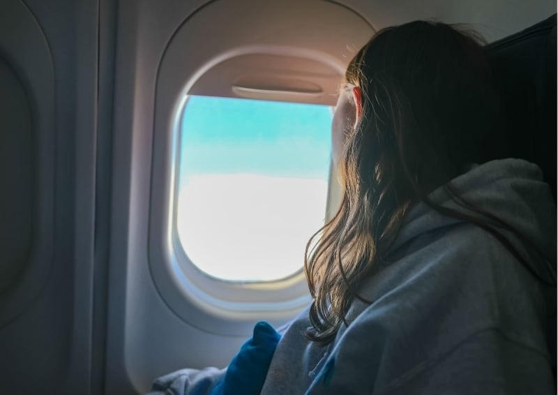 Passenger looking out the window