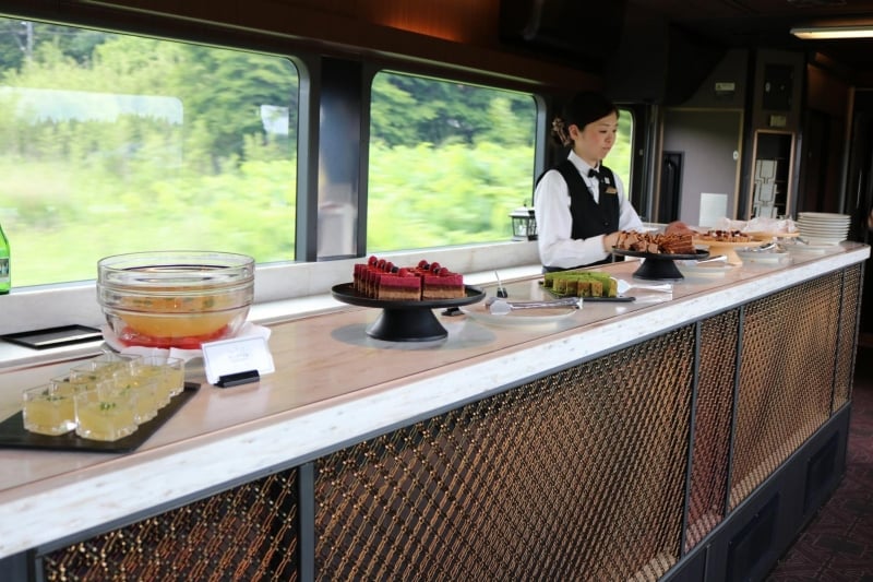 train staff at the dessert counter