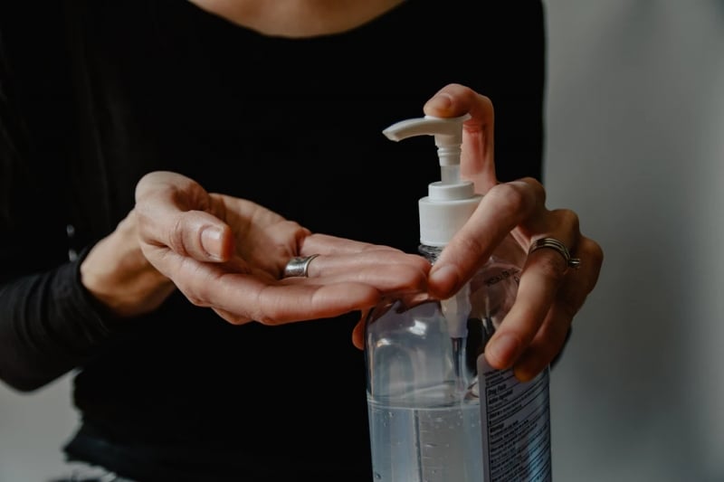 a person using sanitiser