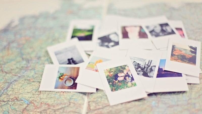 polaroids from a trip set against a map