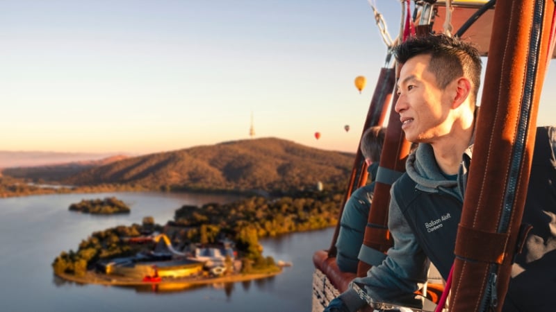 a man on a balloon over canberra, australian capital territory