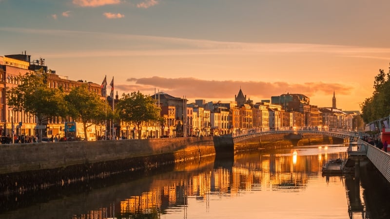 a scenery of a european canal at sunset