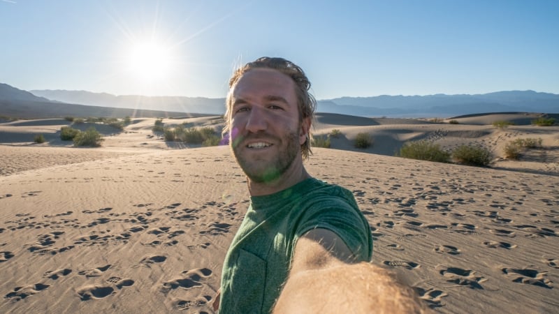 a man taking a selfie in the desert