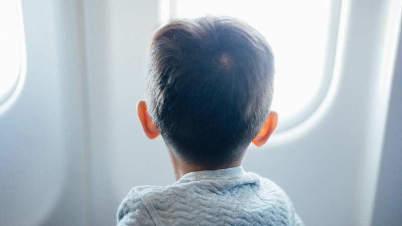 children at window seat 