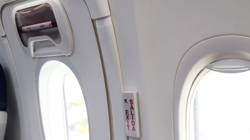 when travelling with children, avoid seats near the emergency exits