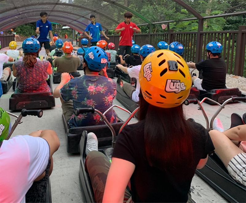 group of riders getting ready to ride the luge