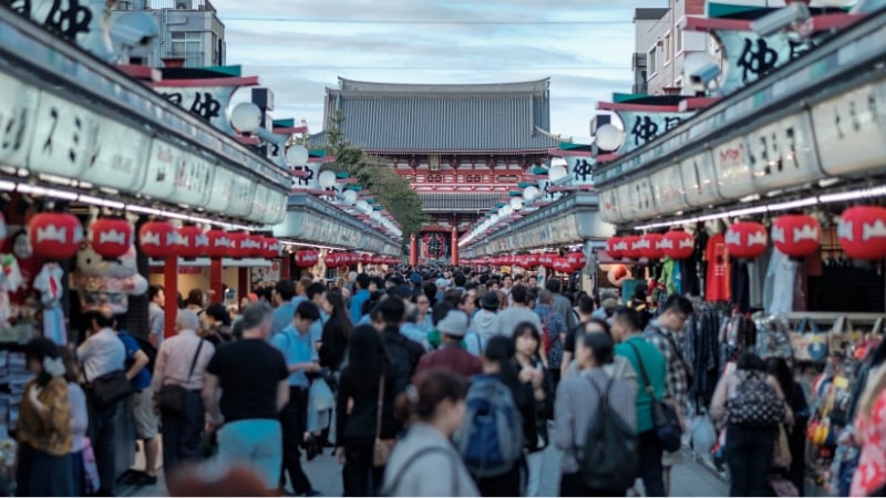 a crowd of tourists at asakusa in tokyo, japan