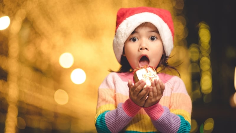 a child with a shocked expression during christmas