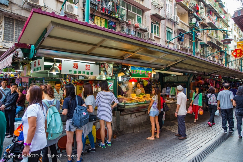 A crowded street with food stalls — Filipinos have to visit Macao for the street food!