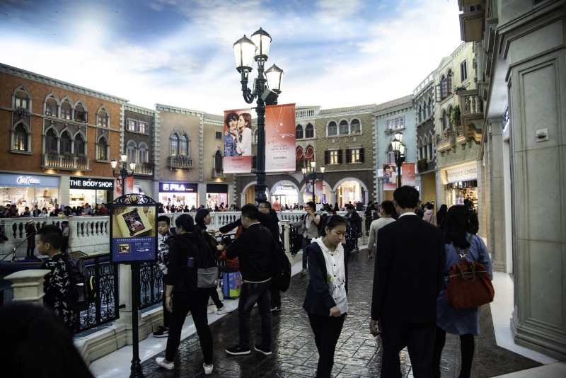 People shopping in a crowded mall