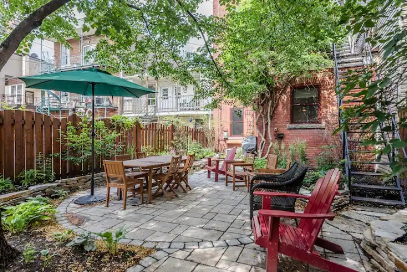 Back garden of this leafy Airbnb in Montreal