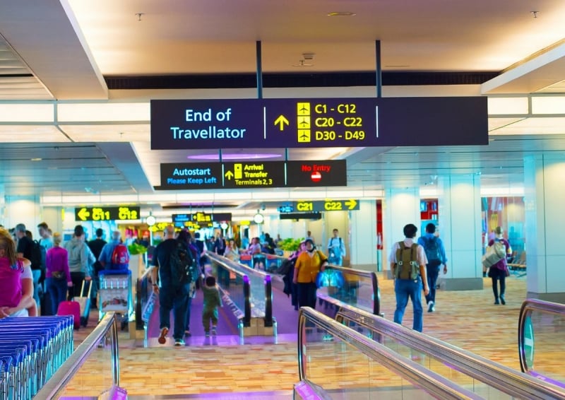 travellers at changi singapore airport