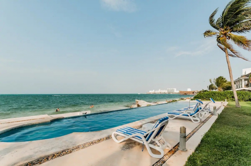spotless cancun airbnb on beach pool